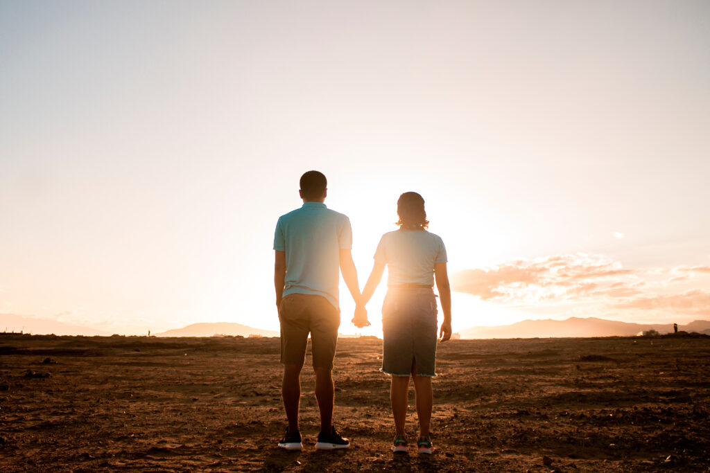 Couple standing before bright future relationship and intimacy coaching